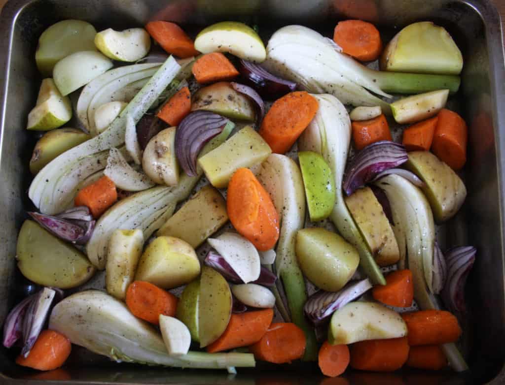 Roasted Winter Vegetables. Here's a wicked mix of garlic, fennel, potatoes, onions, apples and carrots for an easy and tasty accompaniment to roast pork.