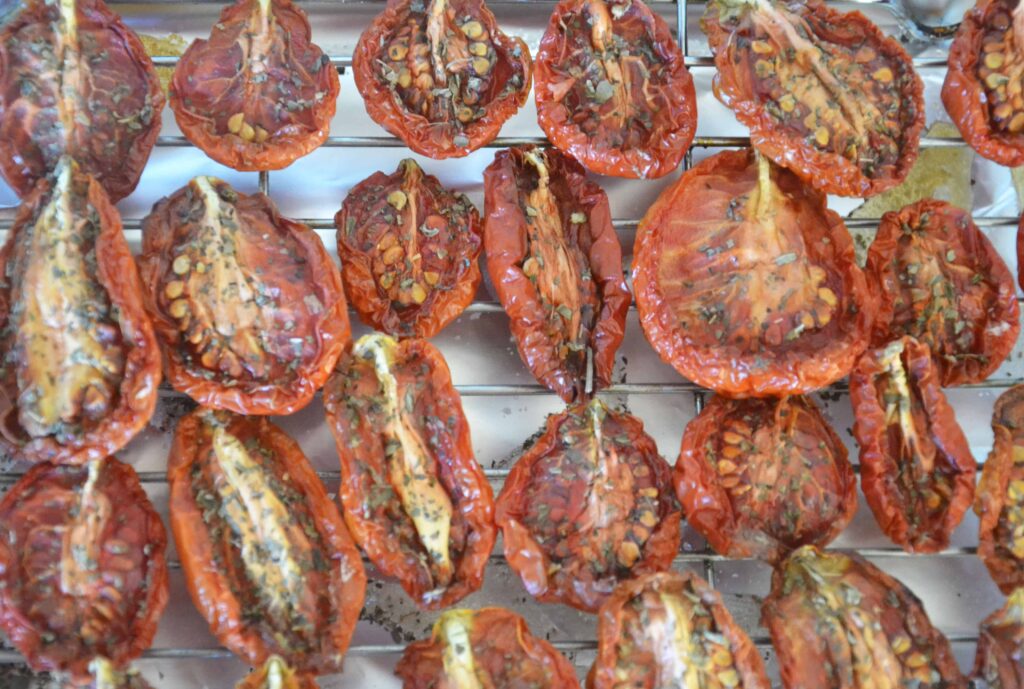 halved tomatoes on a rack after roasting