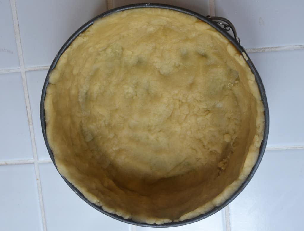 spring form tin lined with hot water crust pastry.