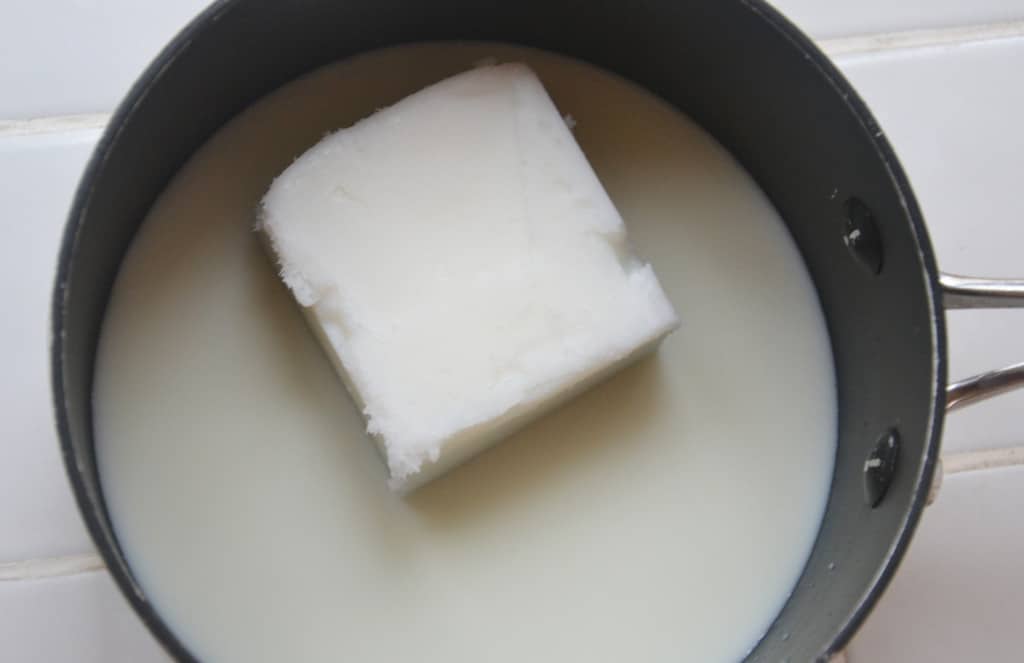 block of lard and milk in a saucepan.