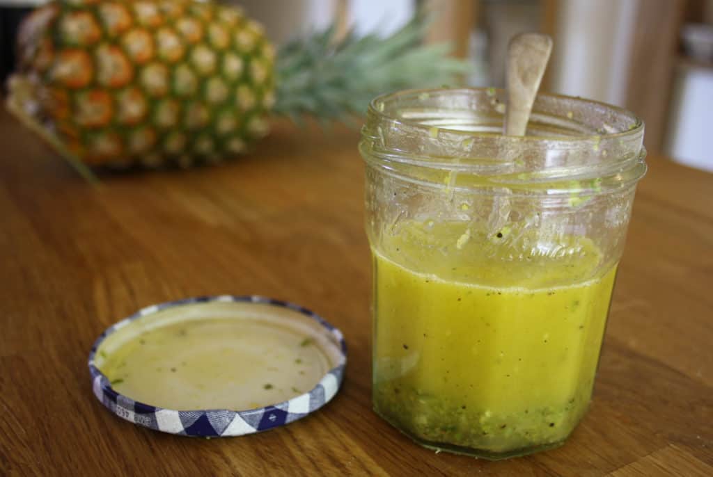 Lemon and lime dressing in a jam jar. 