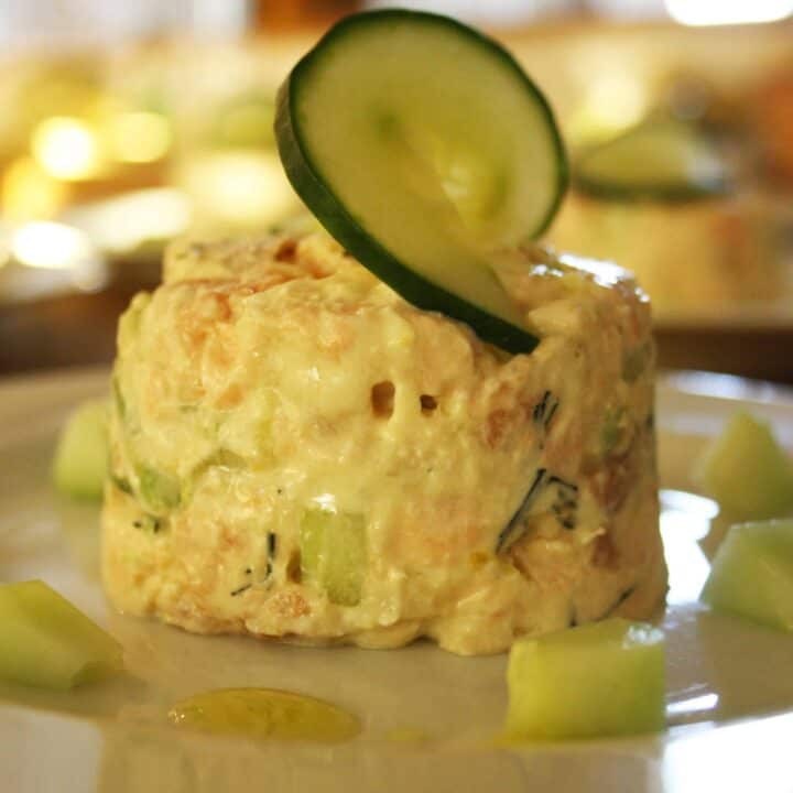 These summer salmon timbales are light and delicate. Smoked and lightly cooked salmon with cucumber and avocado in a creamy dill and lemon dressing.