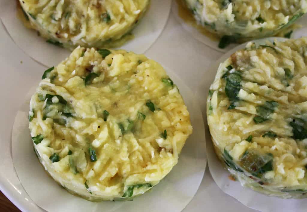 A quick side dish of cheese and onion potato cakes using leftover baked potatoes with parsley or coriander.