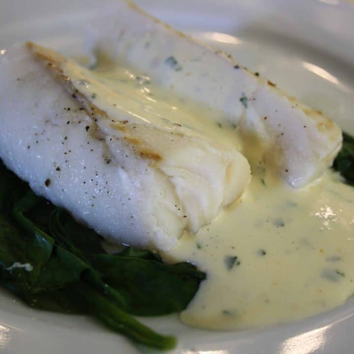 Cod on a bed of spinach simply roasted in the oven and served with a Mousseline sauce which is flavoured with basil.