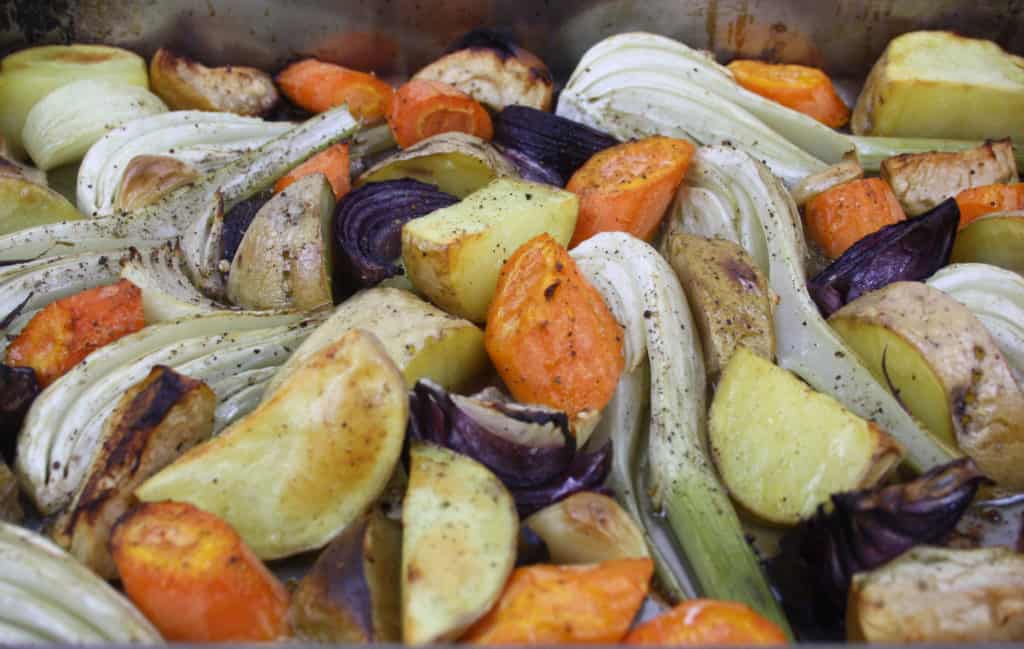 Roasted Winter Vegetables. Here's a wicked mix of garlic, fennel, potatoes, onions, apples and carrots for an easy and tasty accompaniment to roast pork.