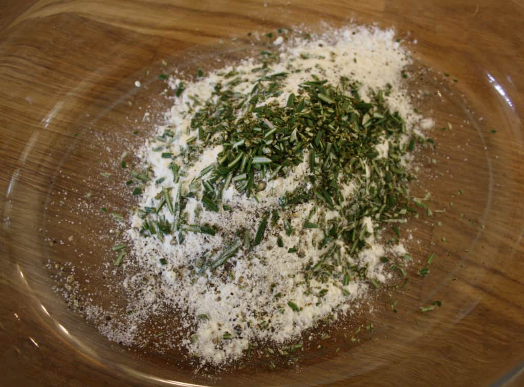 flour mixed with chopped rosemary and seasoning