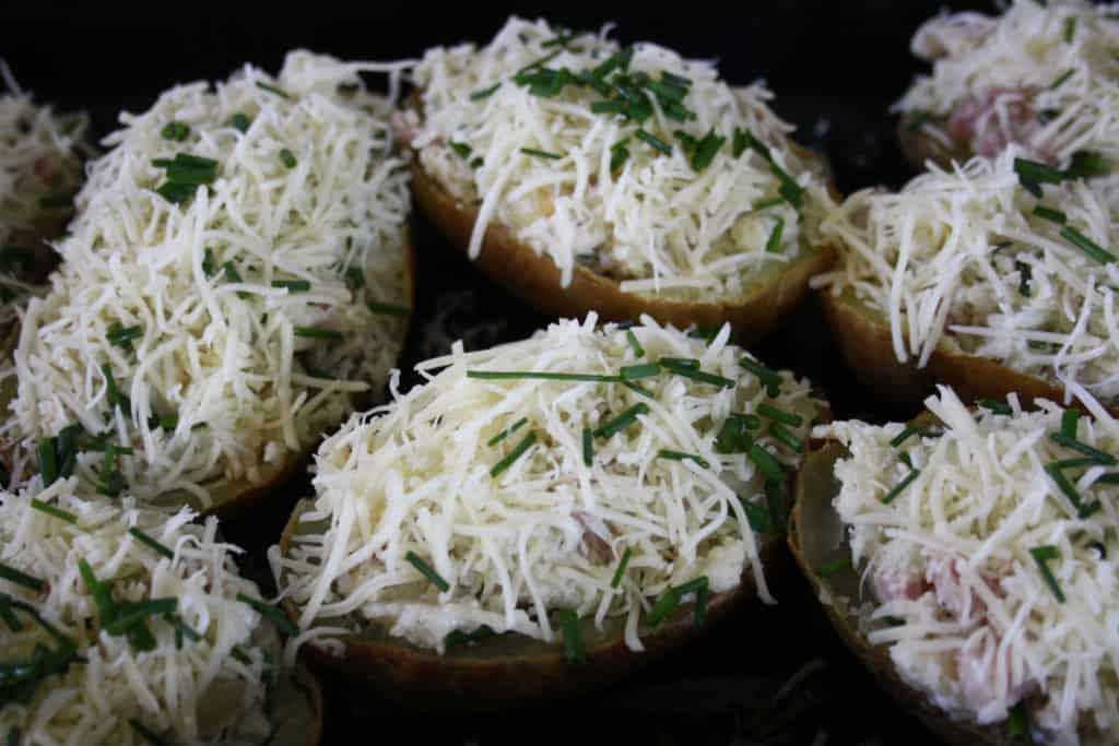 potato halves stuffed and topped with  cheese.