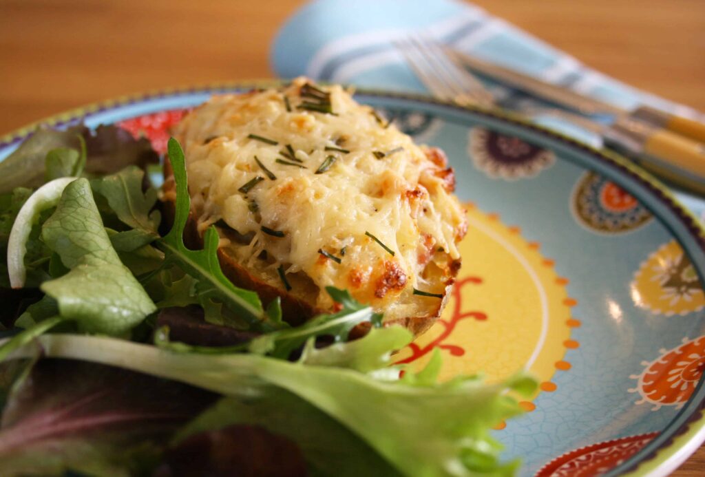 close up of stuffed baked potato.