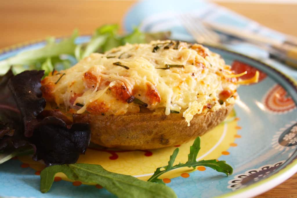 Stuffed jacket potato on a plate.