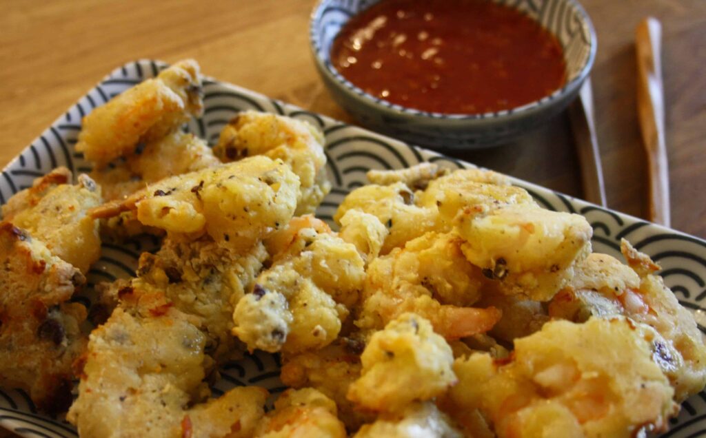 Szechuan Salt & Pepper Prawns. Prawns dipped in flour with Szechuan spice, salt and pepper then baked in the oven rather than fried.