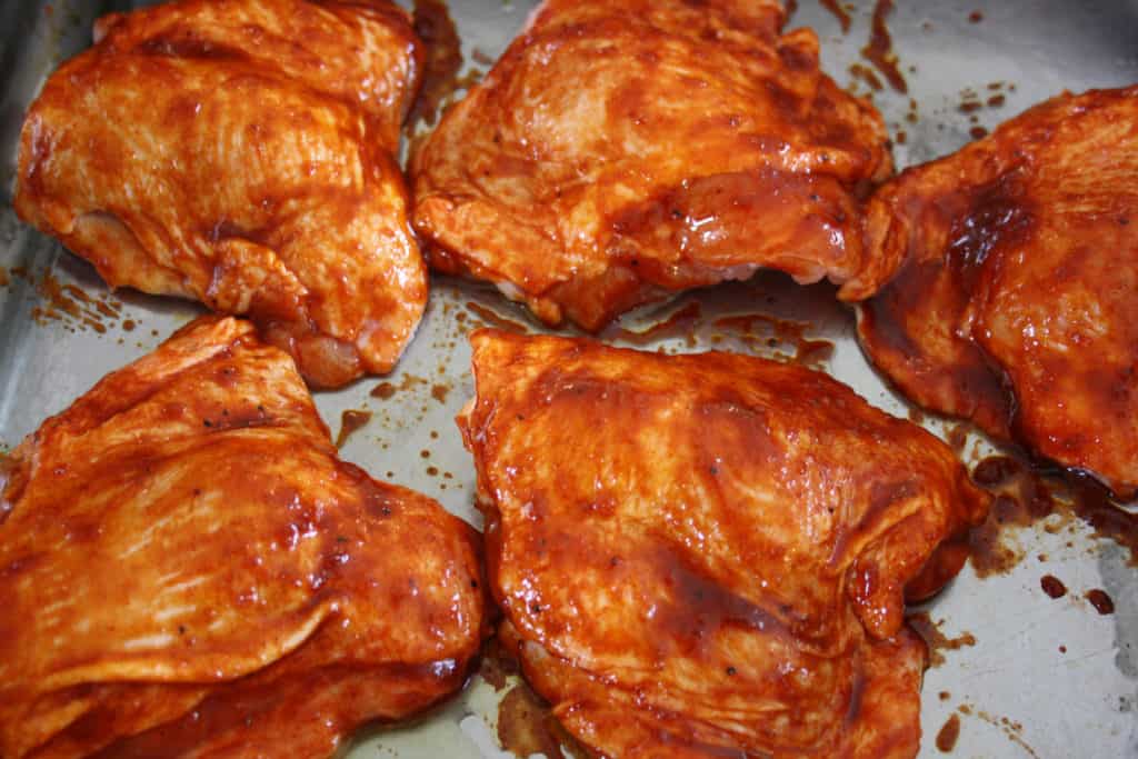 chicken thighs with the paste and honey spread over them.

