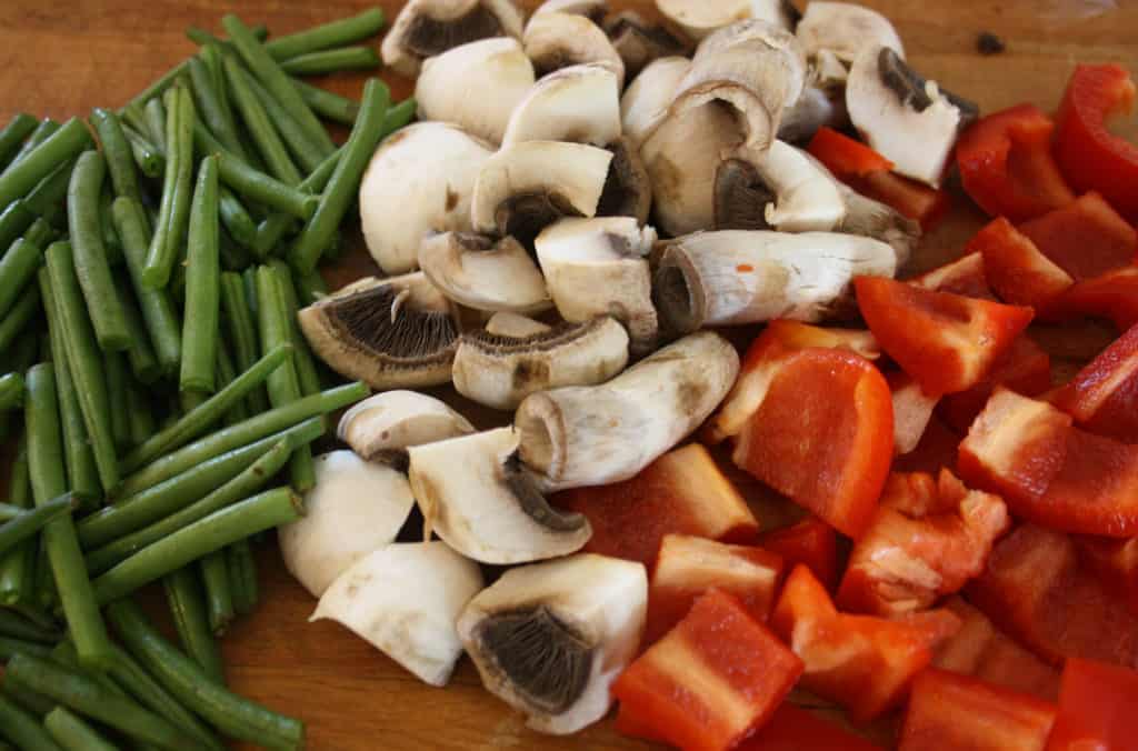 Green beans, mushrooms and peppers cut up.