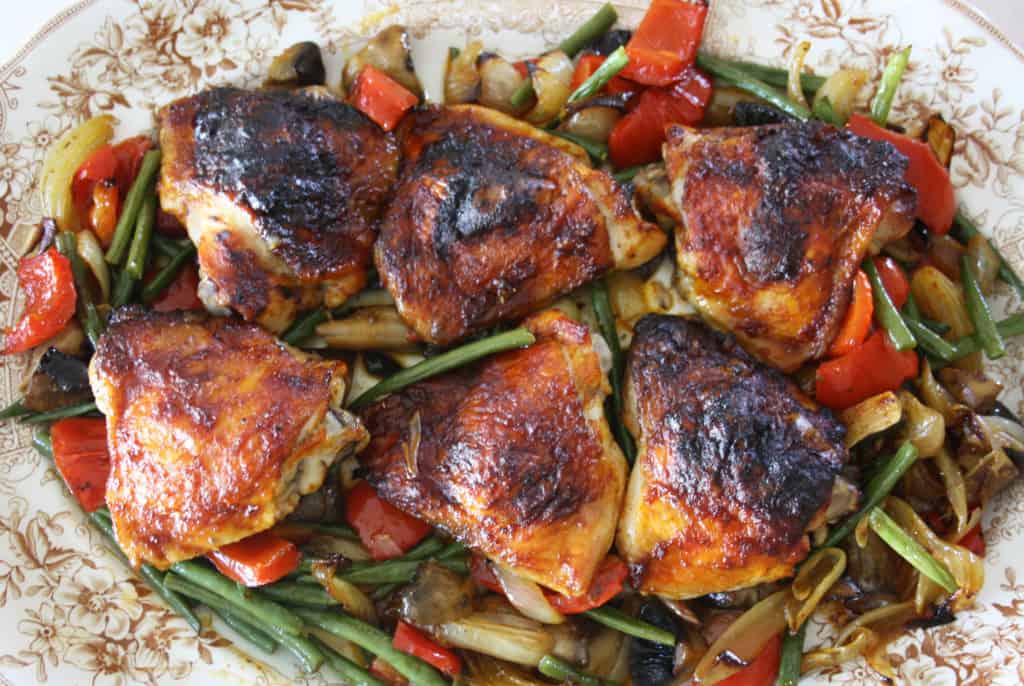 harissa chicken traybake on a large plate.