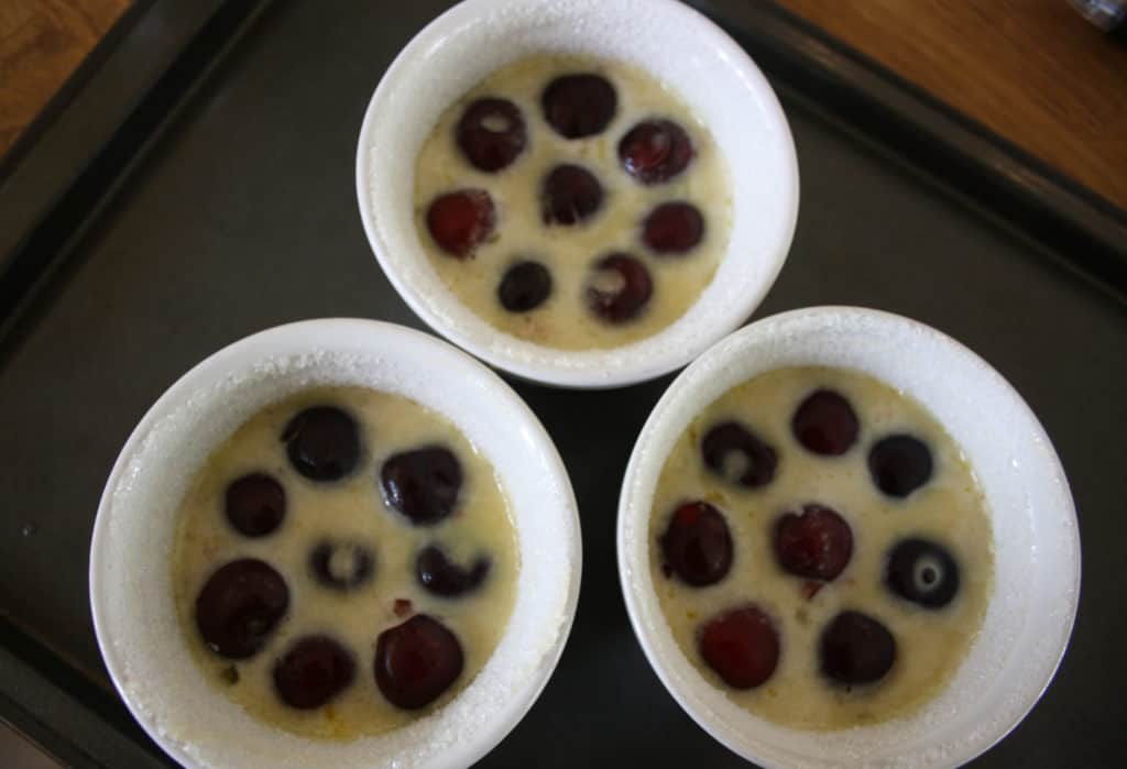 filled ramekins on an oven tray, ready for baking.