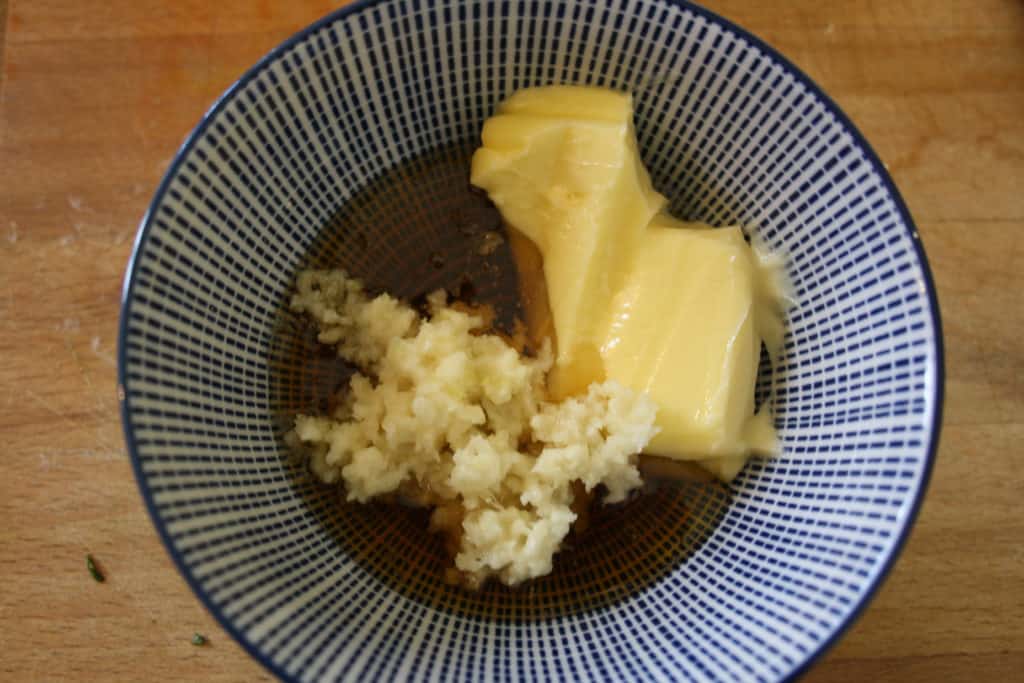 bowl with butter, garlic, honey and lemon.
