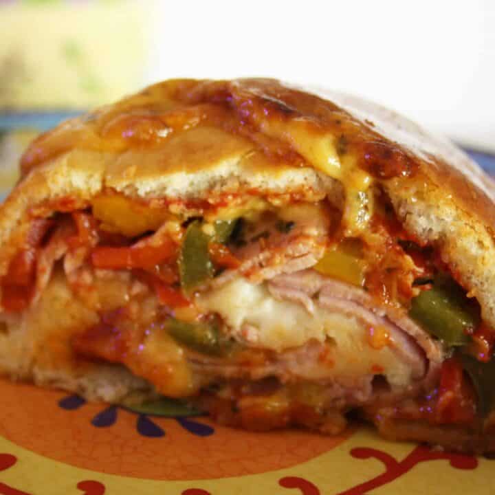 Simple Stromboli. This version uses ready made dough and contents from the fridge for an easy dinner that is cooked in 30 minutes