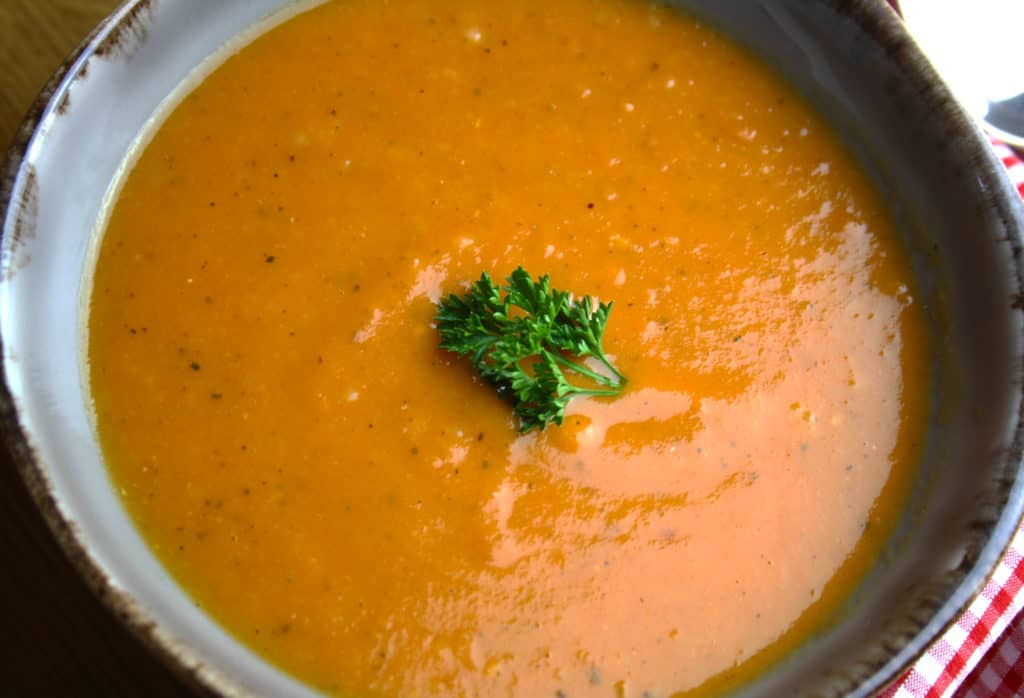 Roasted Tomato Soup with Garlic. Tomatoes and garlic roasted in the oven then combined with stock to make a simple and delicious soup.