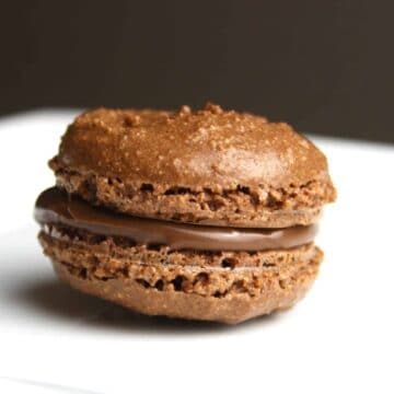 Naughty Nutella Macarons are a must try if you love Nutella. This simple recipe is easy to put together and is certain to wow your guests.