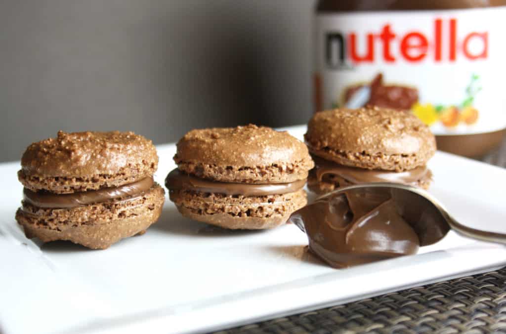 chocolate meringue biscuits with a spoonful of chocolate spread