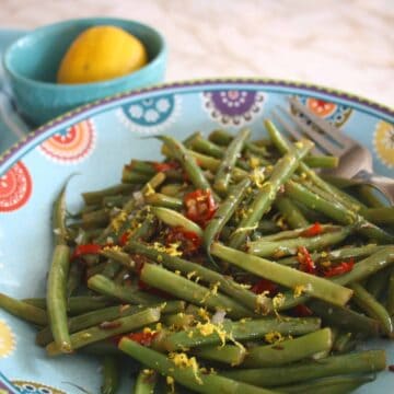 Spicy French Beans with Chilli and Cumin. French beans or haricot verts blanched thin quickly stir fried with cumin and chilli and tossed with lemon.