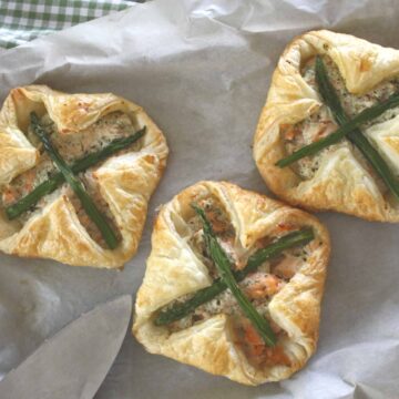 Salmon and Asparagus Puff Pastry Parcels. Poached salmon is mixed with Ricotta cheese, enveloped in puff pastry spread with basil pesto then baked.