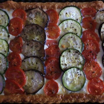 Vegetable Mozzarella Tart. Puff pastry topped with yummy mozzarella then slices of aubergine, courgette and tomato before being baked until bubbling.