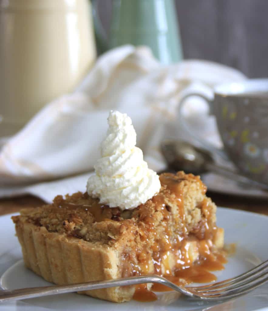 Apple Caramel Crumble Tart. Shortcrust pastry tart case filled with apple, pecans and caramel then topped with nutty crumble