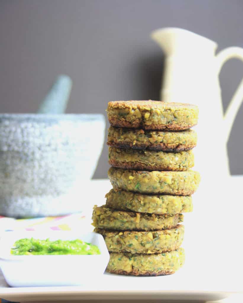 plate of falafel burgers in a stack and pesto 