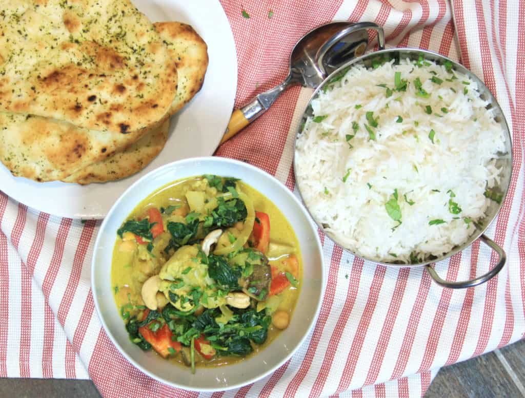 picture of vegetable curry, rice and naan from overhead