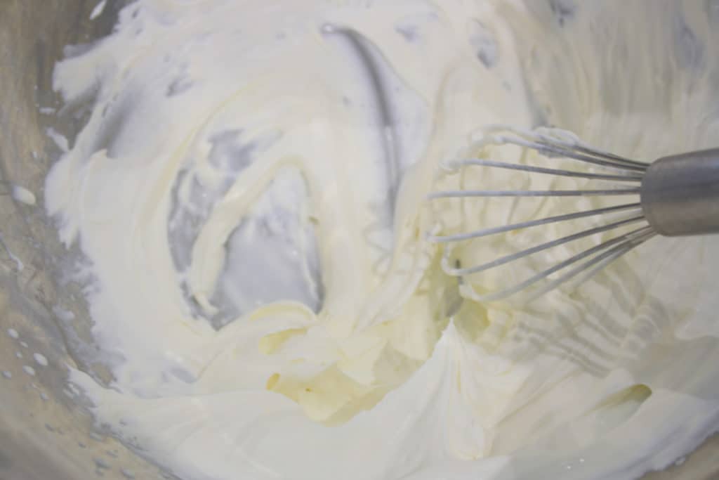 bowl of cream being whisked
