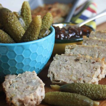 slices of haslet and bowl of cornichons