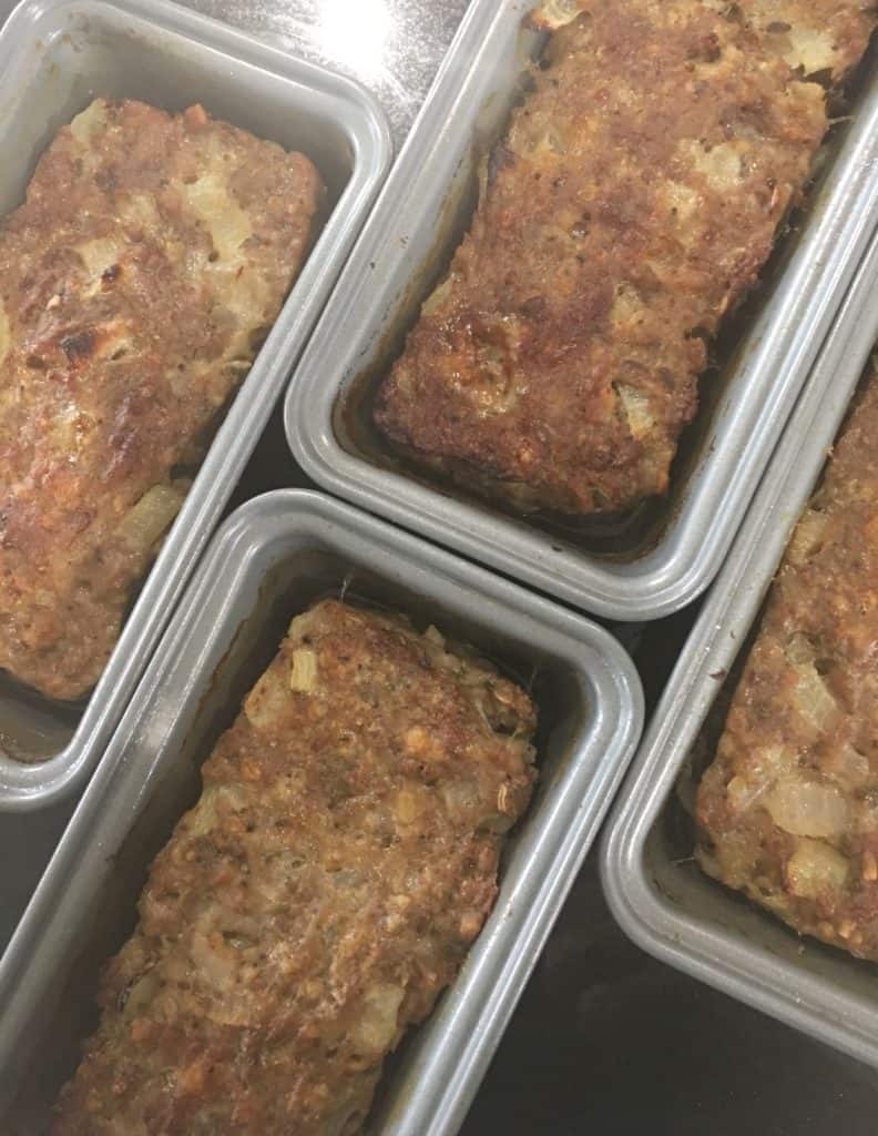 overhead view of the haslets when they have just come out of the oven in their tins