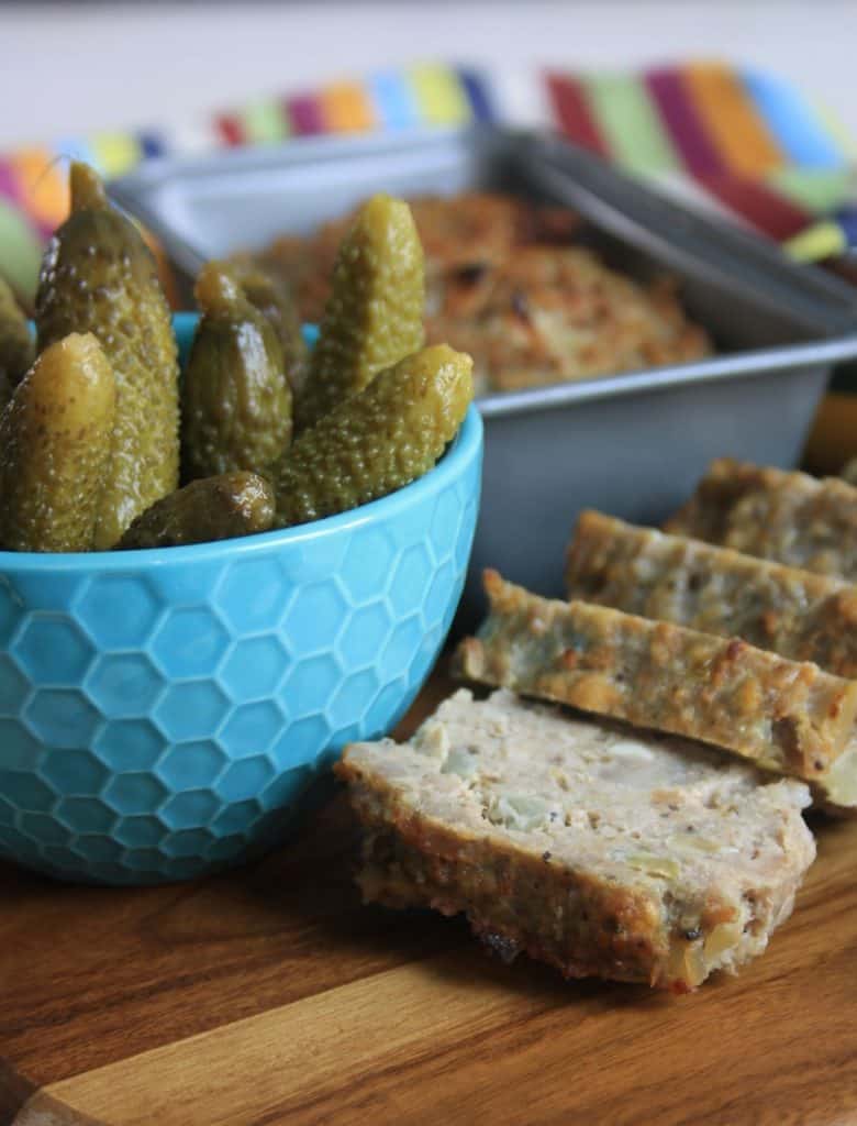 Slices of haslet and pot of cornichons