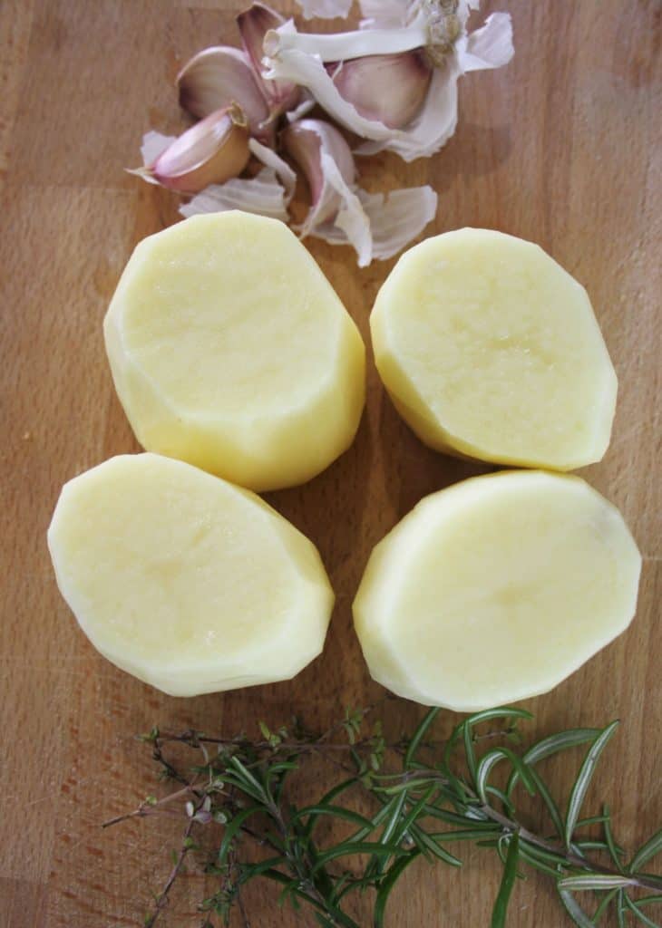 Raw peeled potatoes, shaped fromthe top