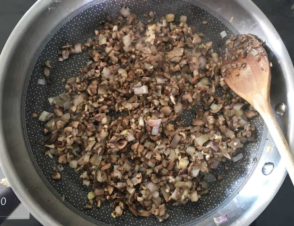 mushrooms duxelles in a frying pan.