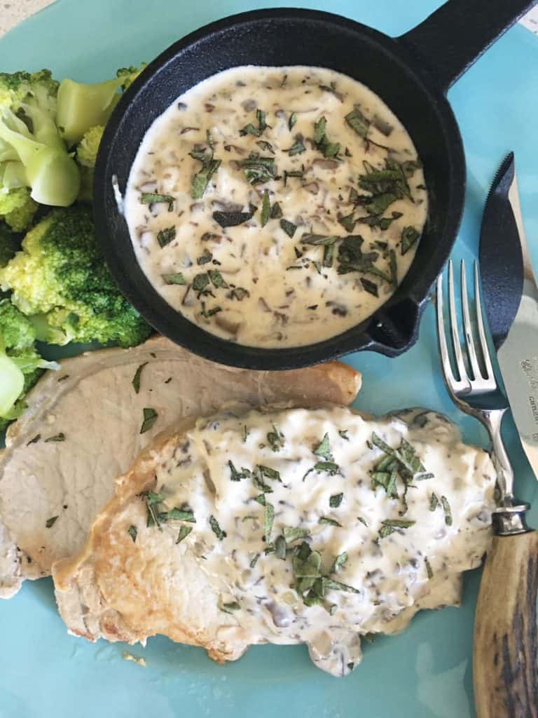 Overhead picture of  mushroom cognac sauce in a pot.