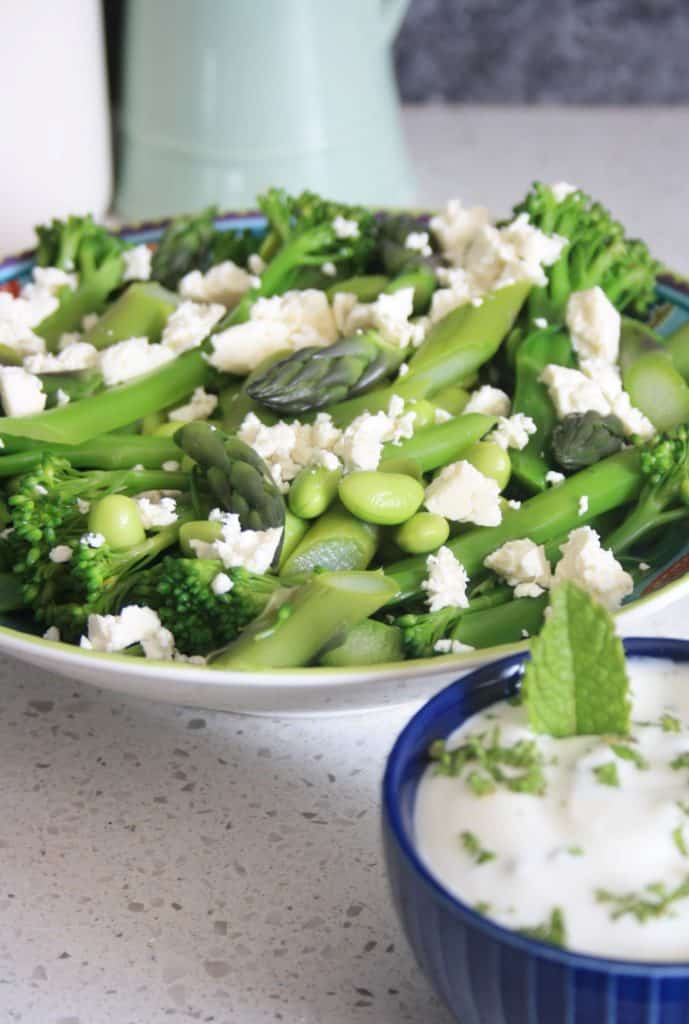 bowl of broccoli salad with yogurt dip.