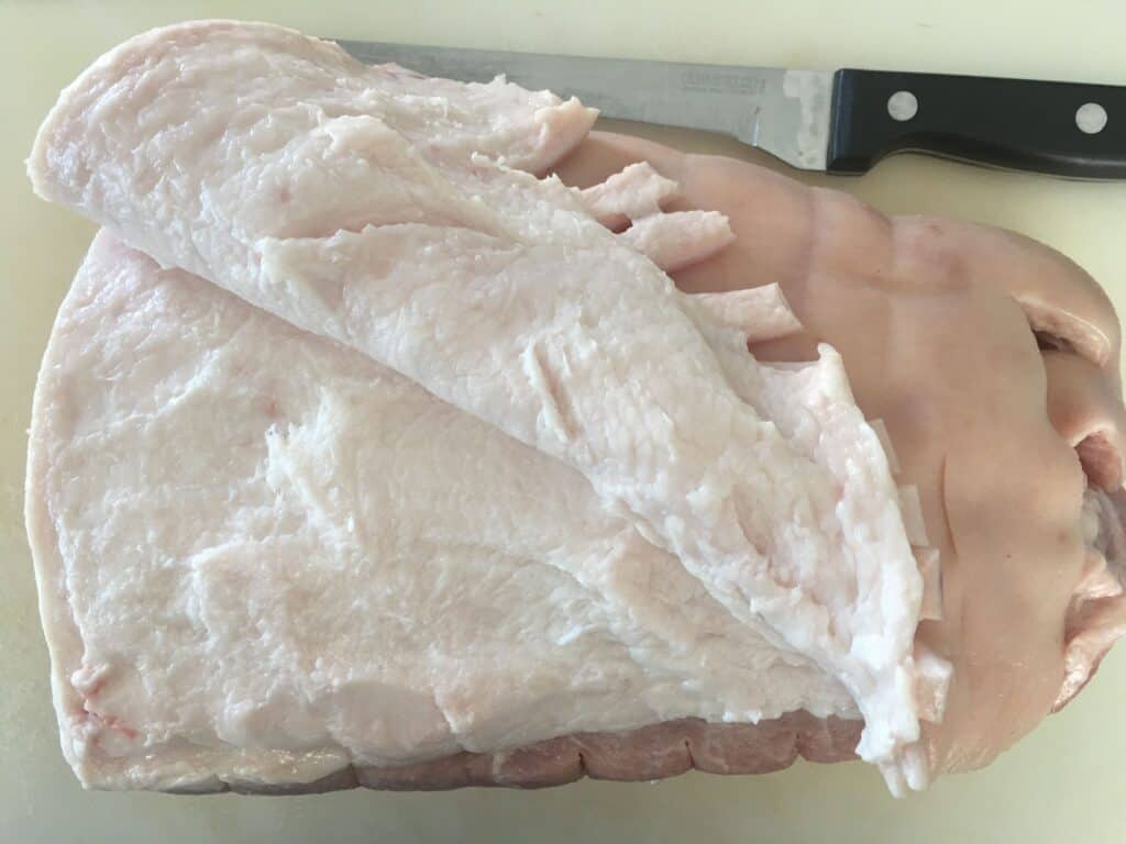 pork joint with skin being removed