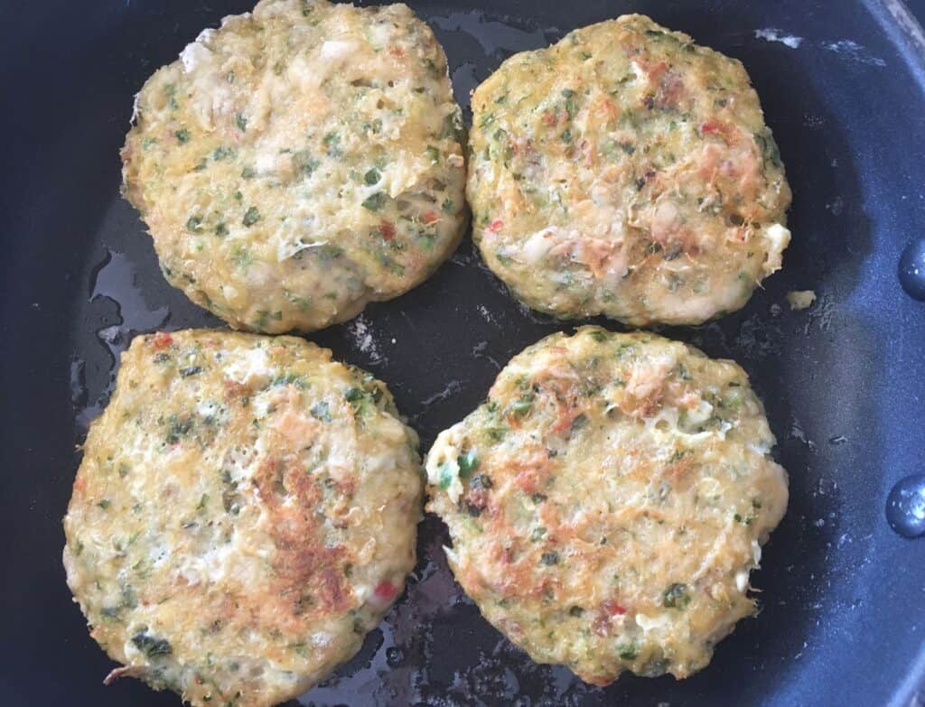 burgers in a frying pan