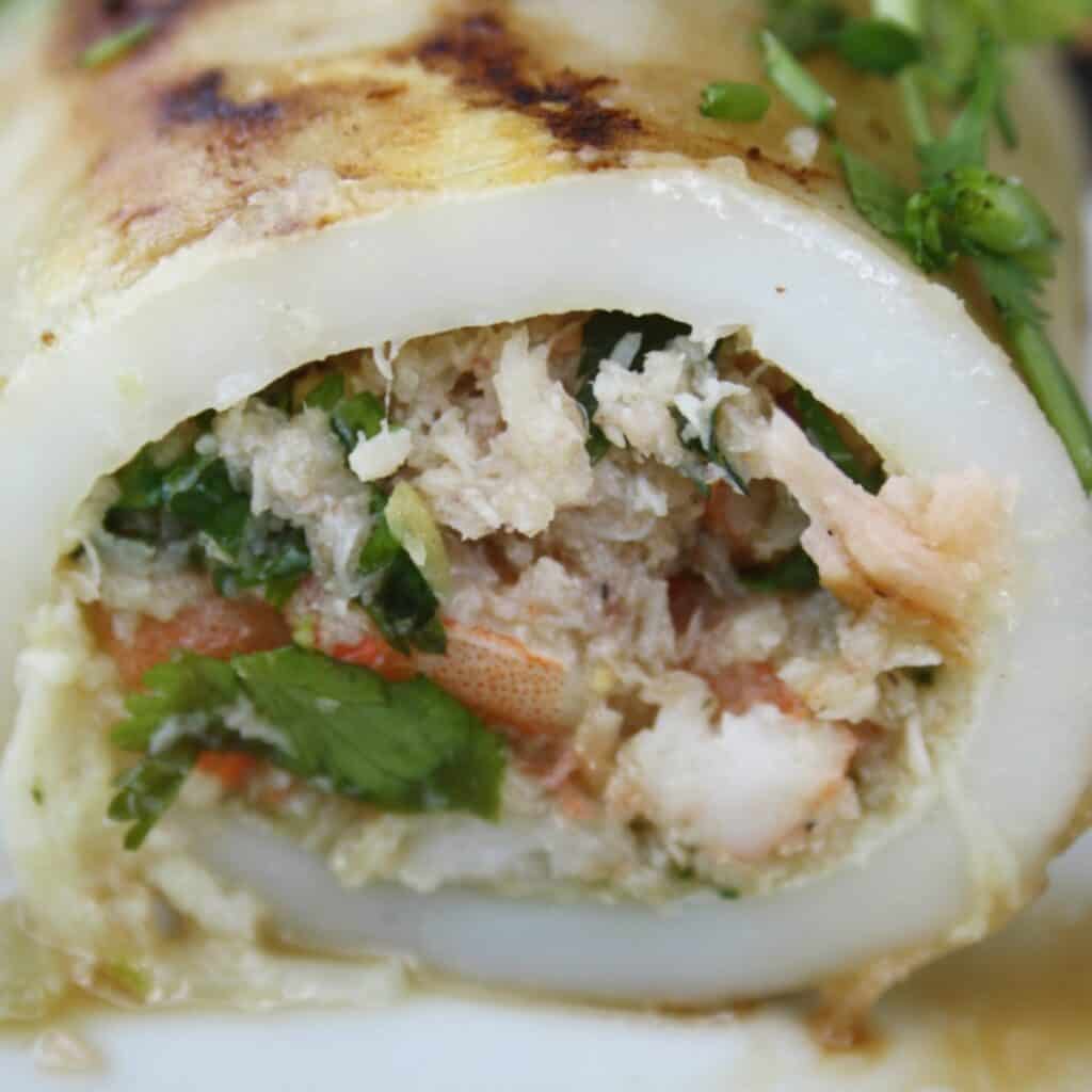 side view of squid stuffed with prawns and crab.