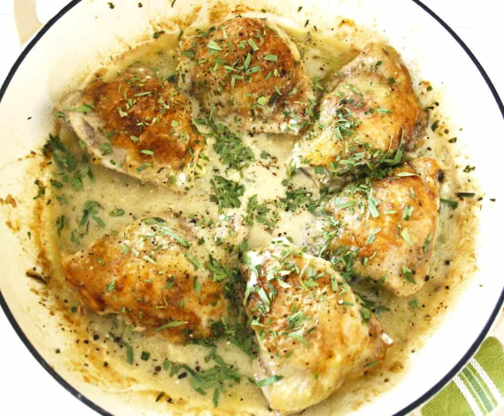 chicken in a pan with sauce