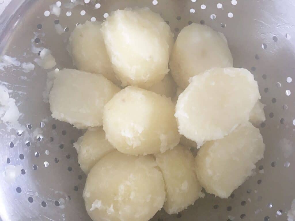 boiled potatoes in a colander