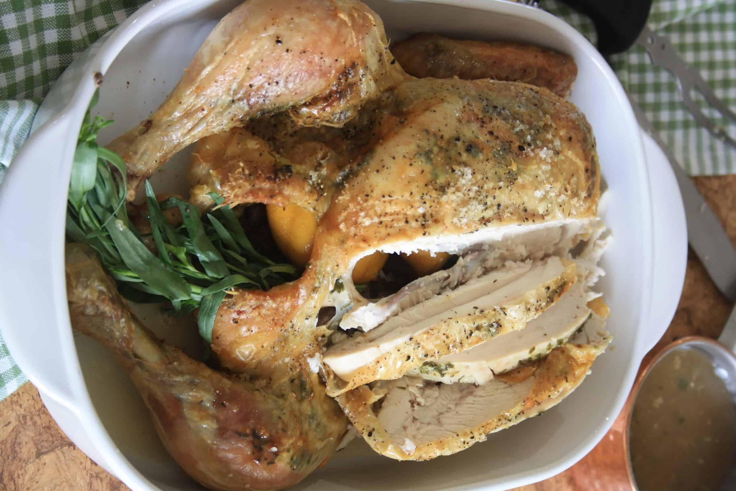 whole roast chicken with slices cut.