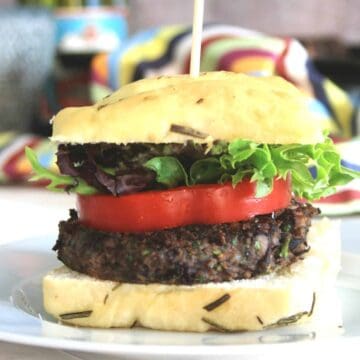 side view of vegan black bean burger with peppers.