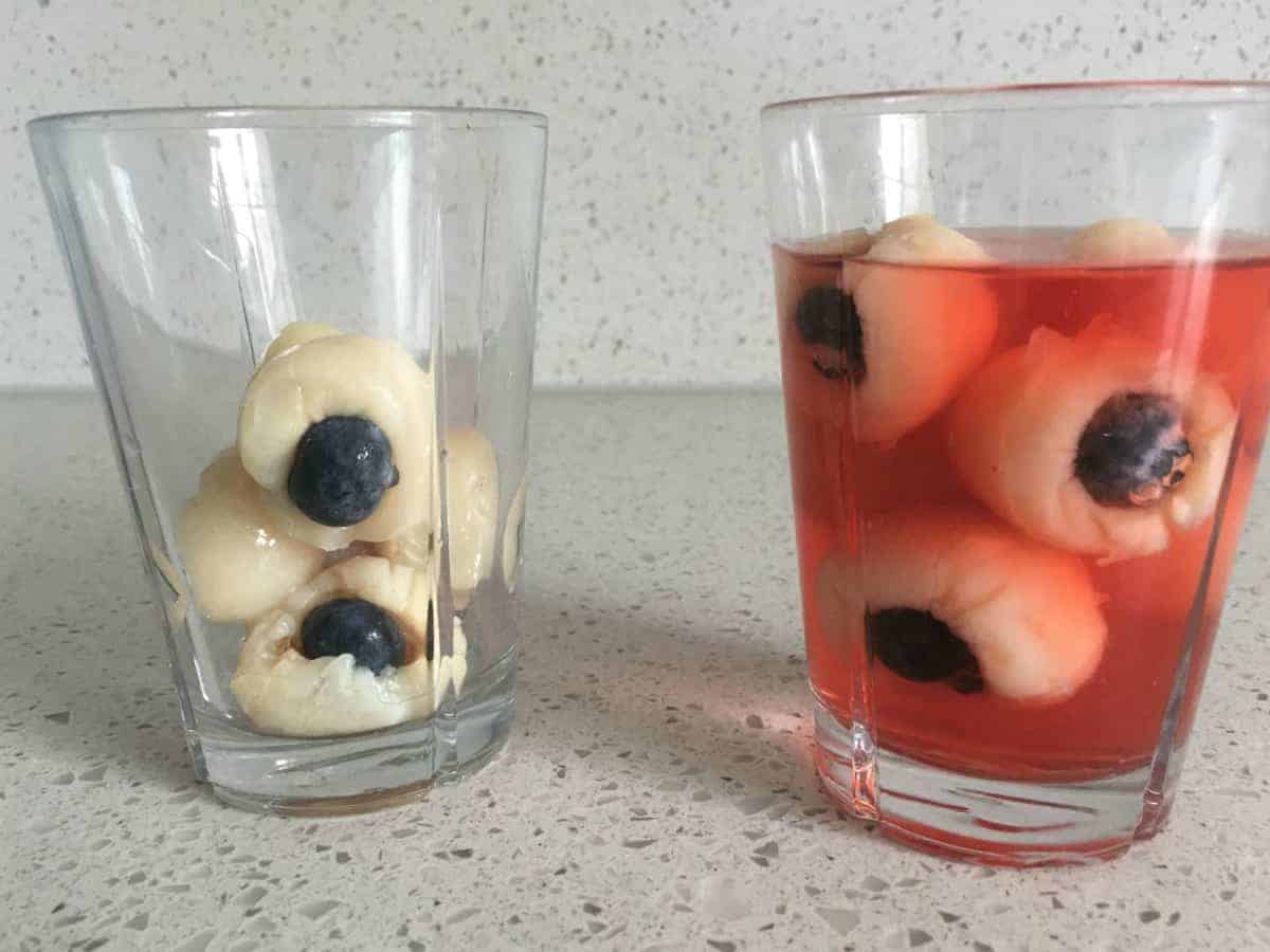 lychees in a glass and another glass with lychees and jelly