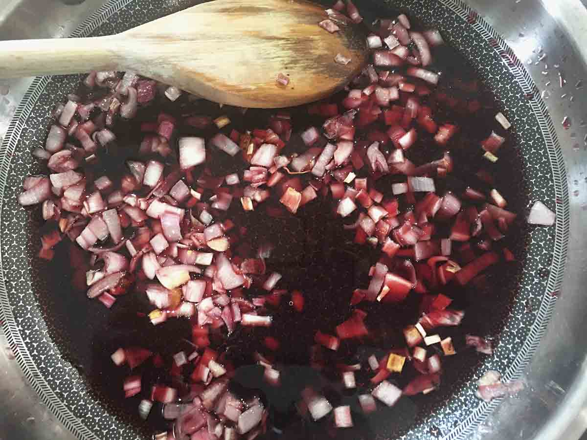 shallots and red wine in a pan.