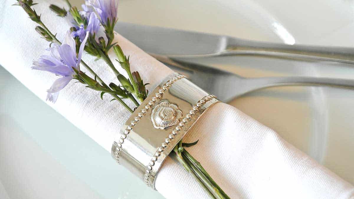 close up of tucked into a napkin ring.
