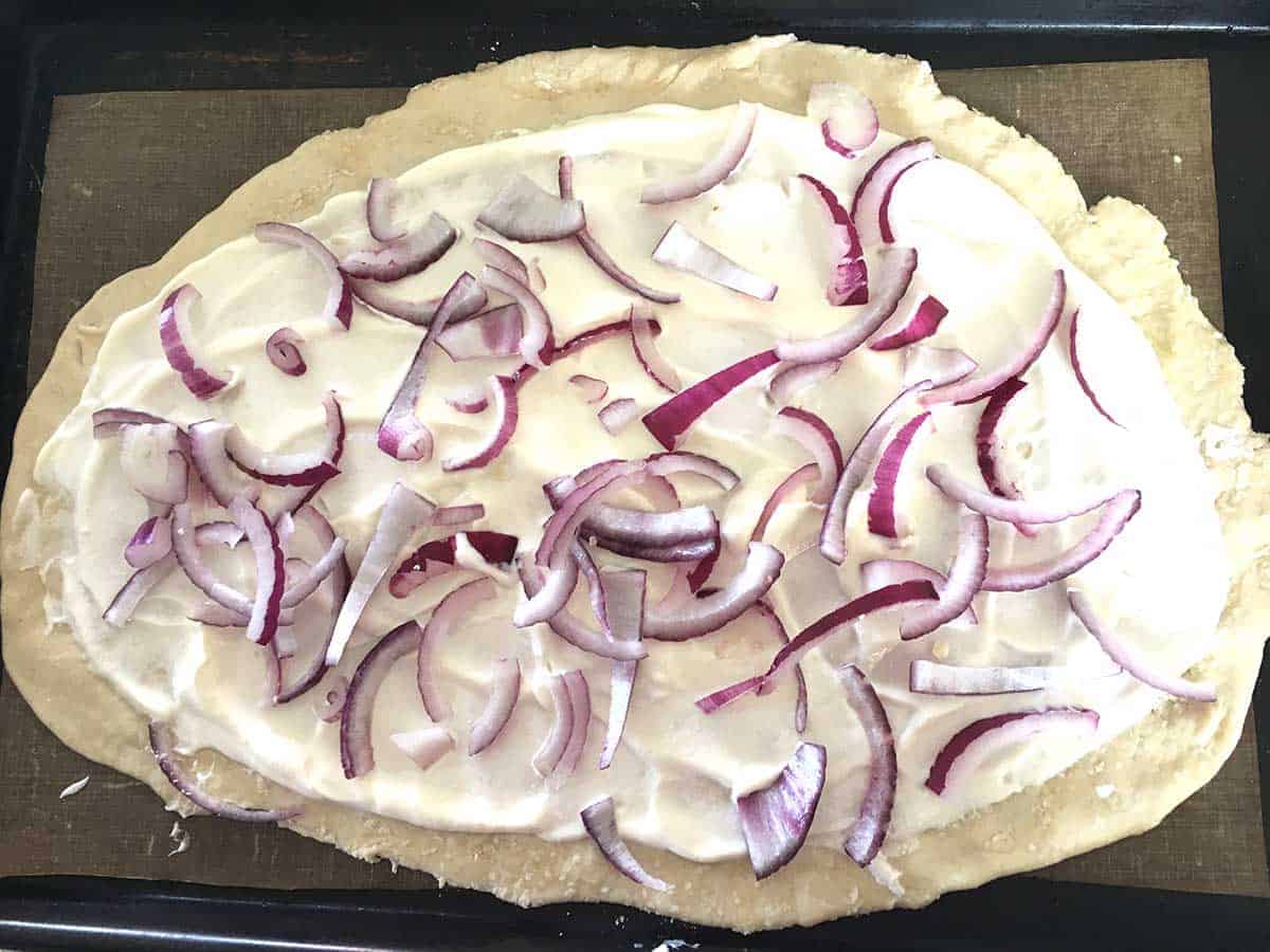 tarte with creme fraiche and red onions.