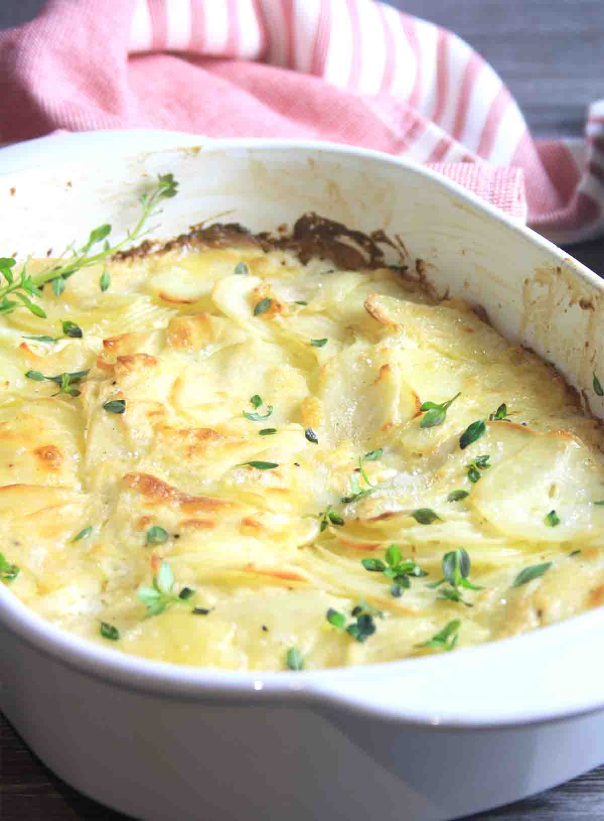 dish of cooked baked potatoes.