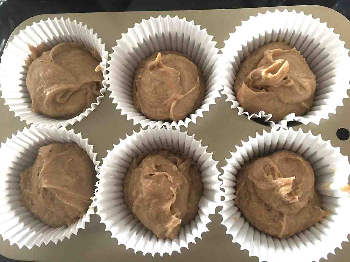 muffin cases filled with mixture.